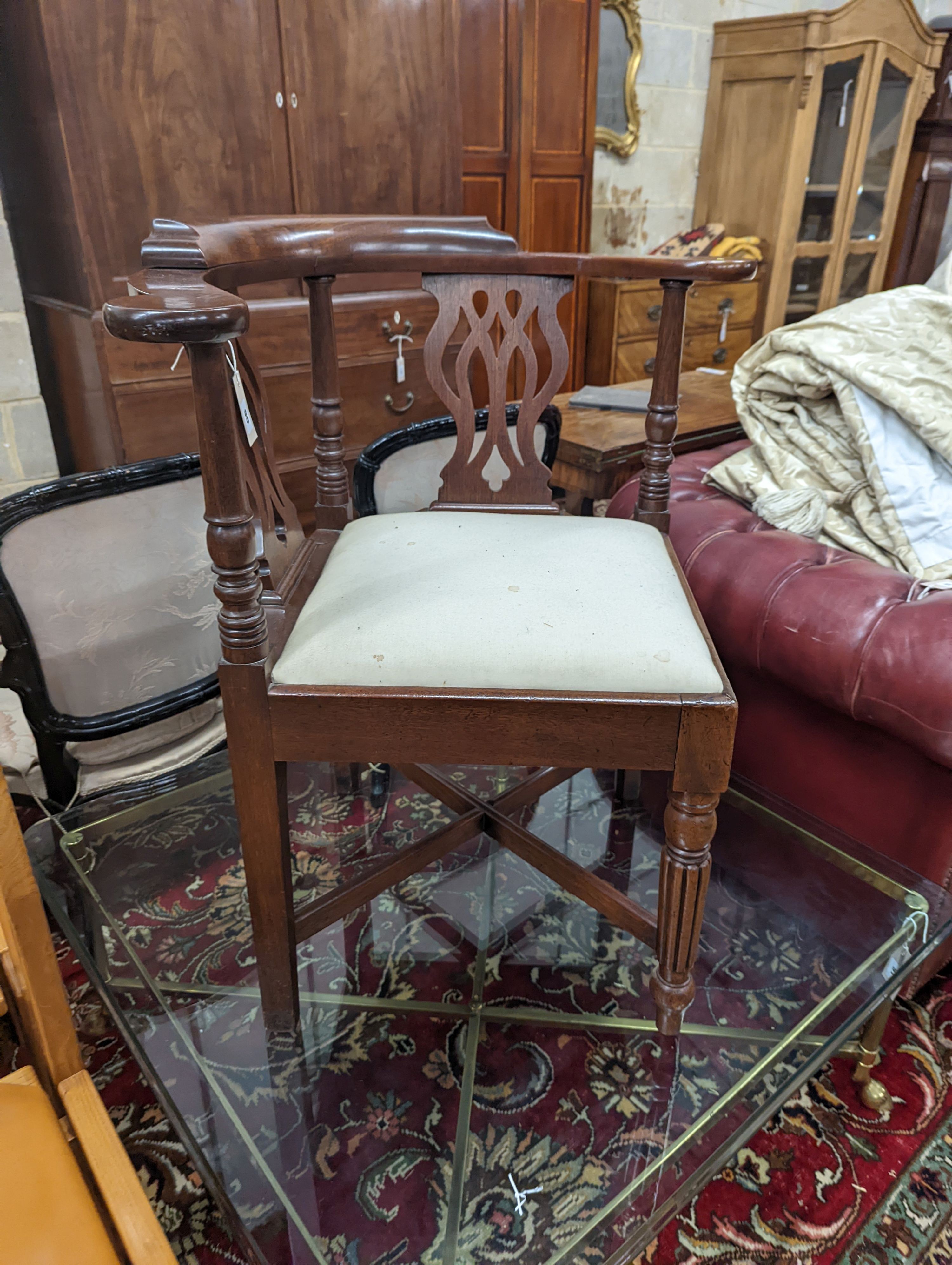 A George III mahogany corner elbow chair, width 76cm, depth 64cm, height 81cm